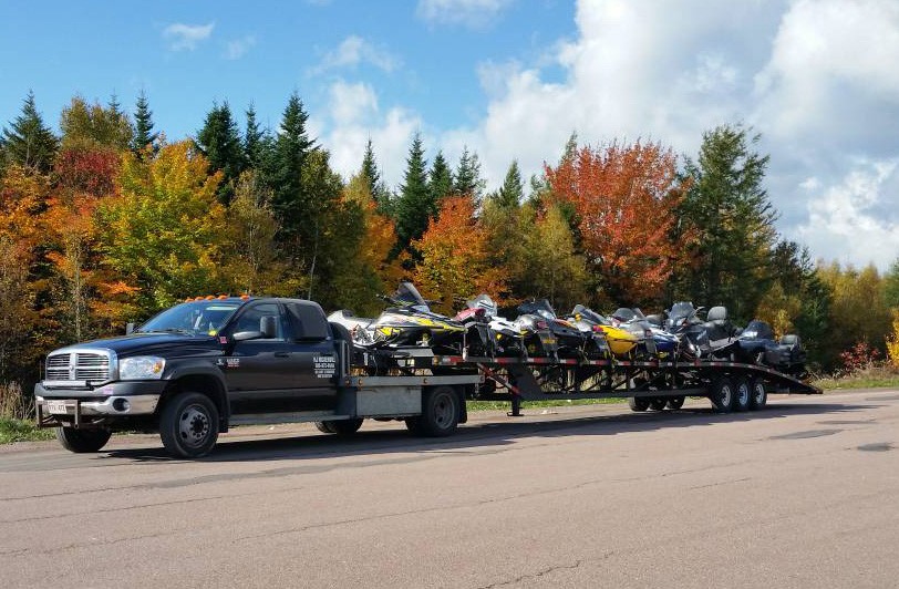 Snowmobile hauling 7 12 shipping a snowmobile cross country